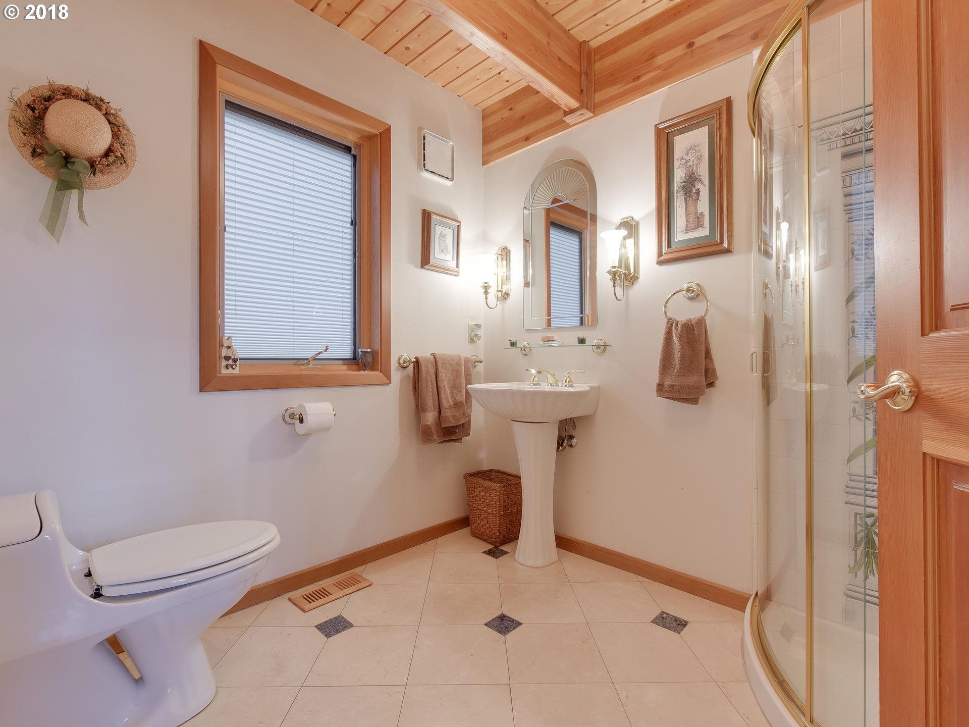 22200 East Lolo Pass Road Rhododendron, OR 97049 - Photo 20 of 32 a bathroom with a toilet sink and mirror