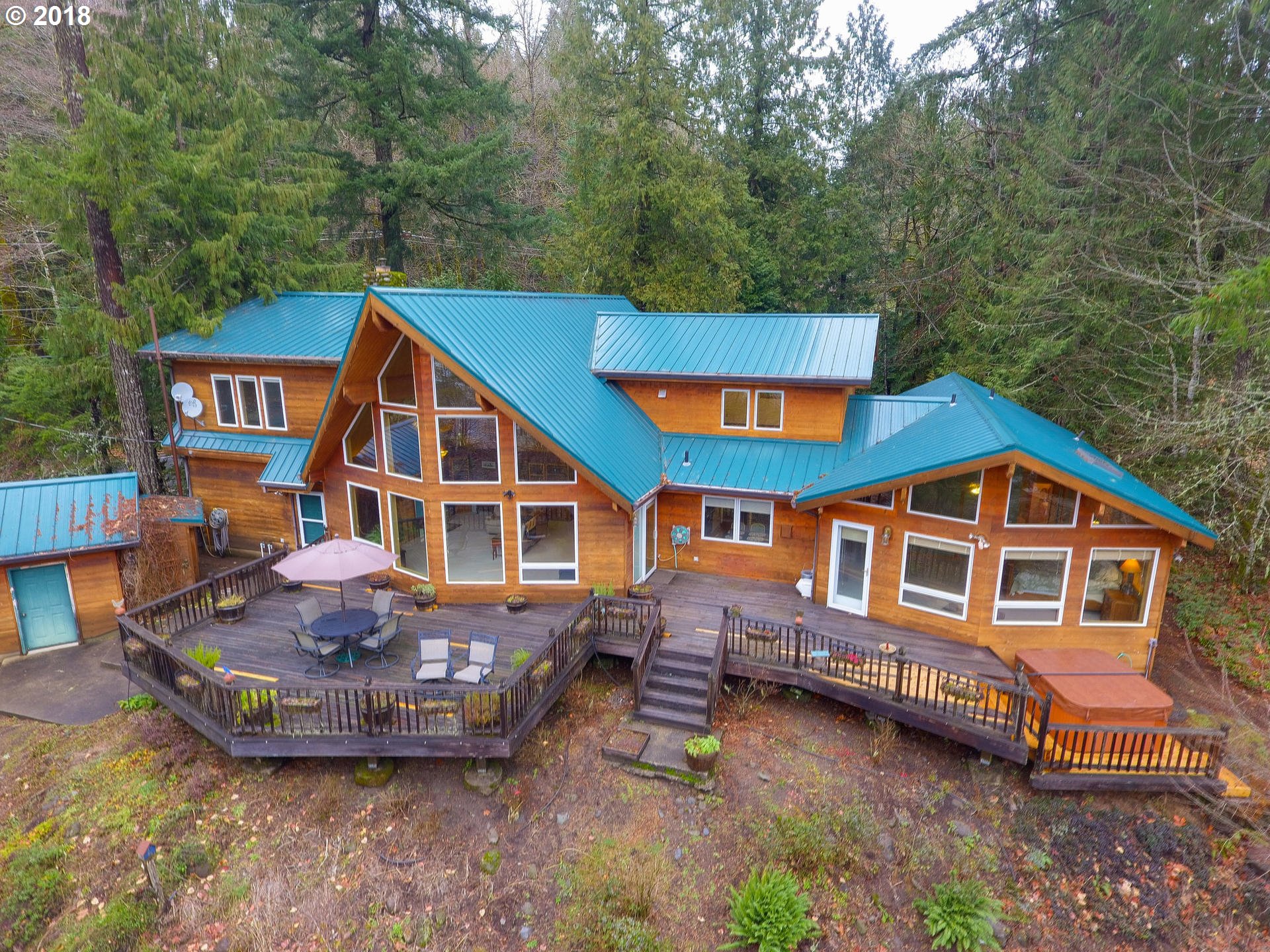 22200 East Lolo Pass Road Rhododendron, OR 97049 - Photo 4 of 32 a aerial view of a house with pool and sitting area