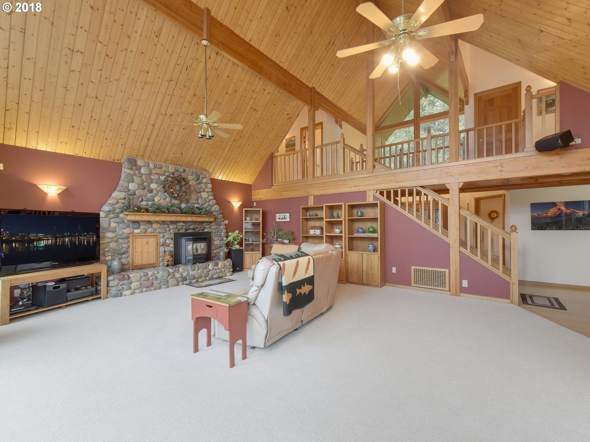 22200 East Lolo Pass Road Rhododendron, OR 97049 - Photo 9 of 32 a living room with furniture and a flat screen tv