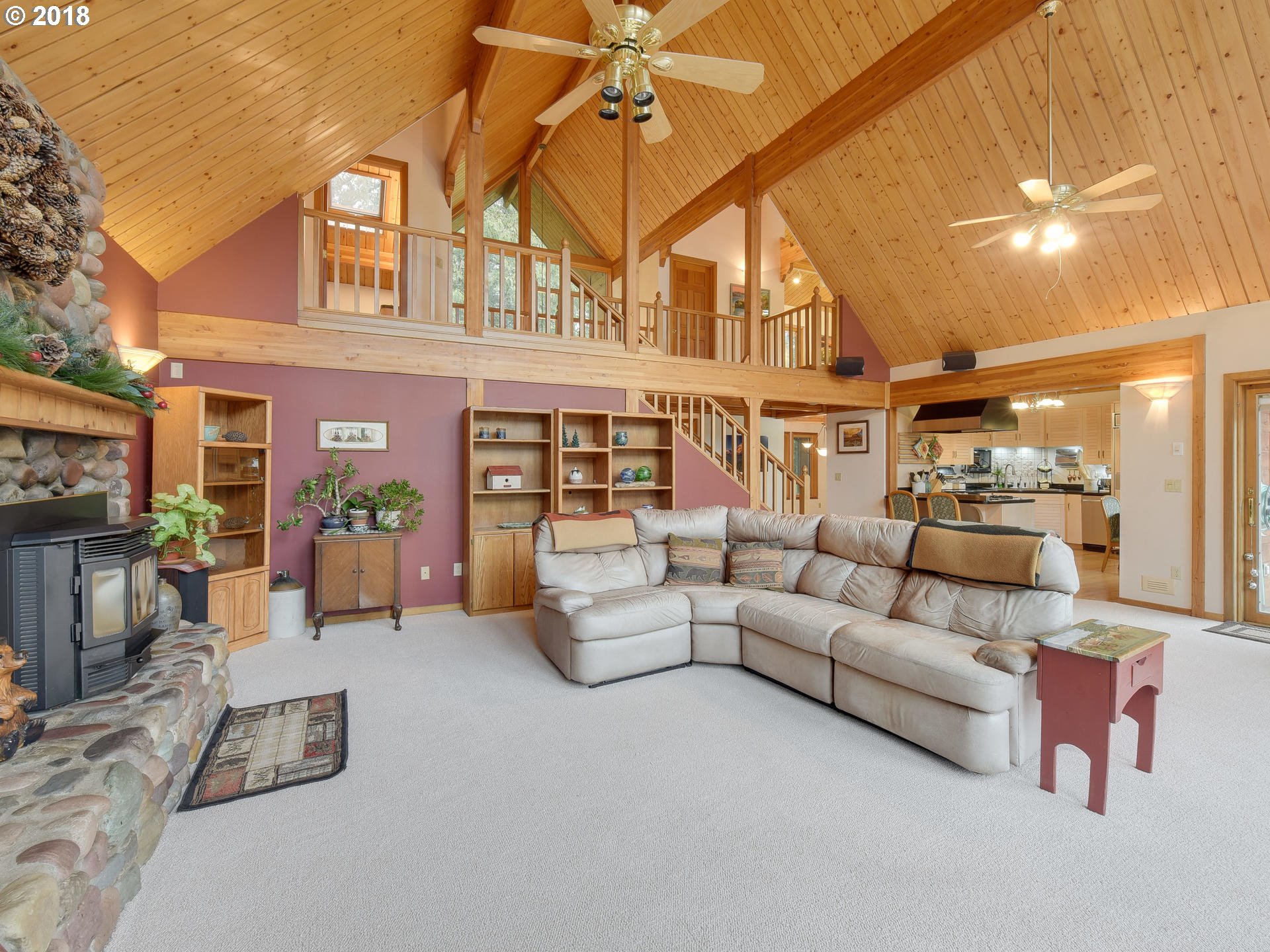 22200 East Lolo Pass Road Rhododendron, OR 97049 - Photo 10 of 32 a living room with furniture and a fireplace