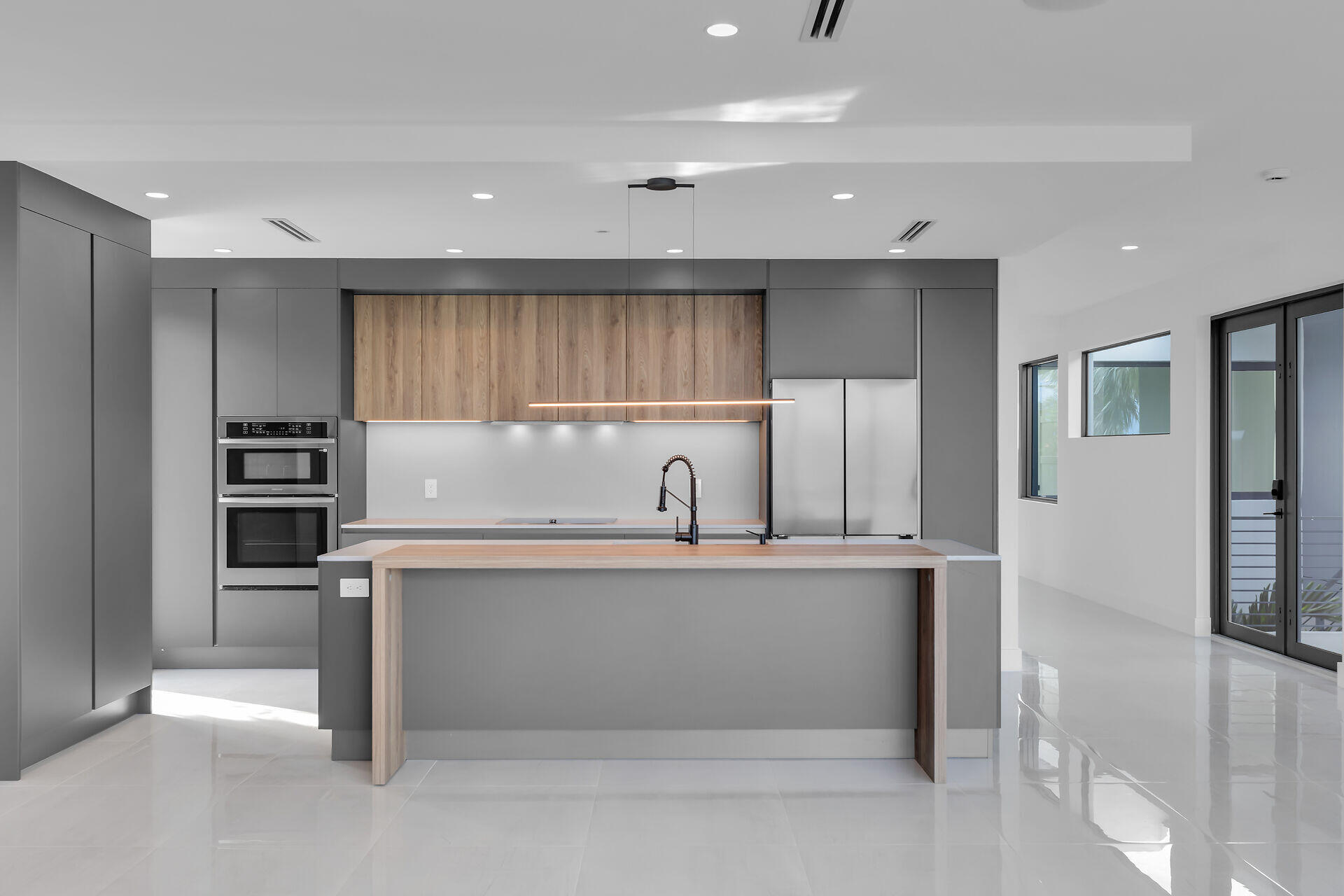 62 Mutiny Place Key Largo, FL 33037 - Photo 25 of 70 a kitchen with stainless steel appliances granite countertop a sink and a refrigerator