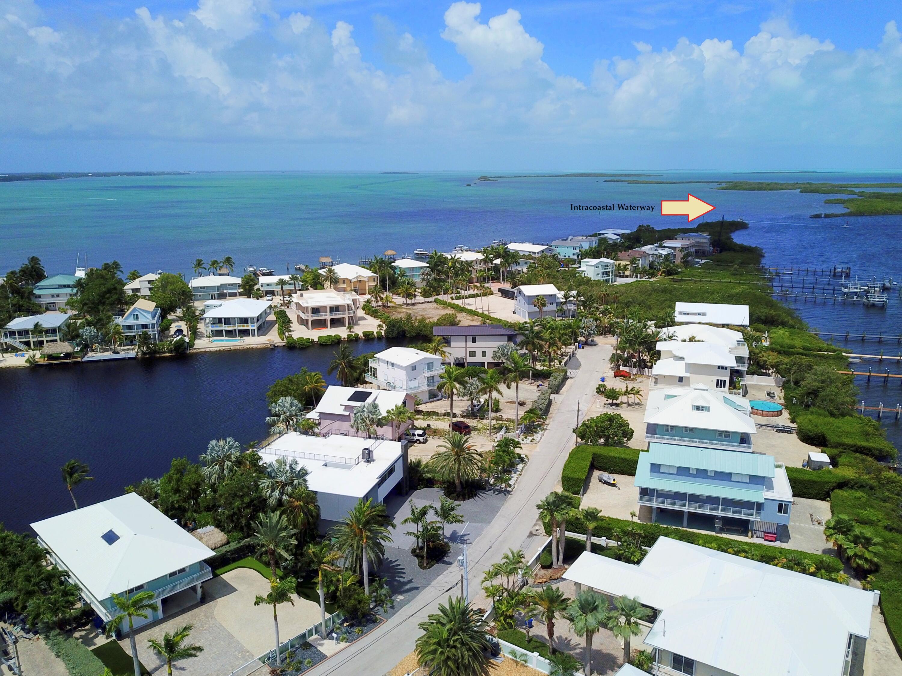 62 Mutiny Place Key Largo, FL 33037 - Photo 3 of 70 an aerial view of a house with a ocean view