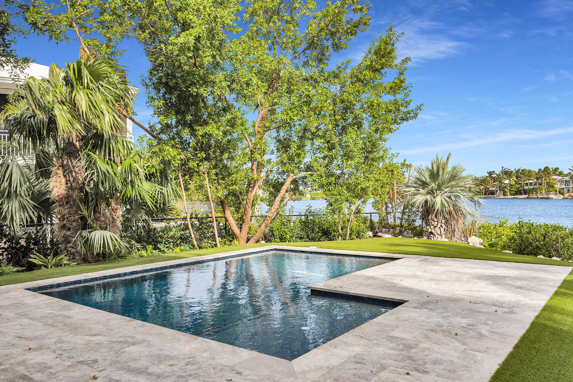 62 Mutiny Place Key Largo, FL 33037 - Photo 54 of 70 a view of a swimming pool with a yard