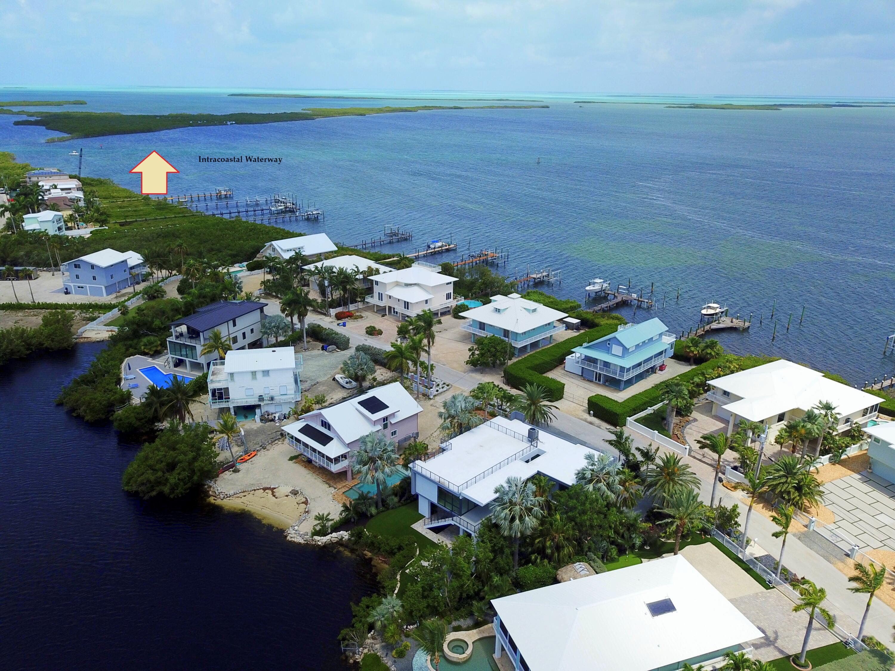 62 Mutiny Place Key Largo, FL 33037 - Photo 6 of 70 an aerial view of a house with a lake view