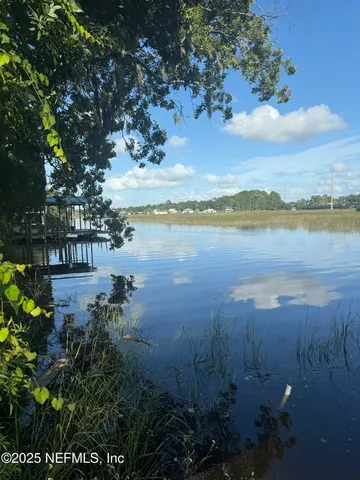 a view of a lake with a mountain in the background