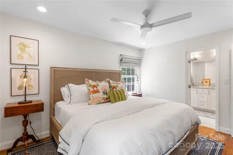 a bedroom with a bed and a table