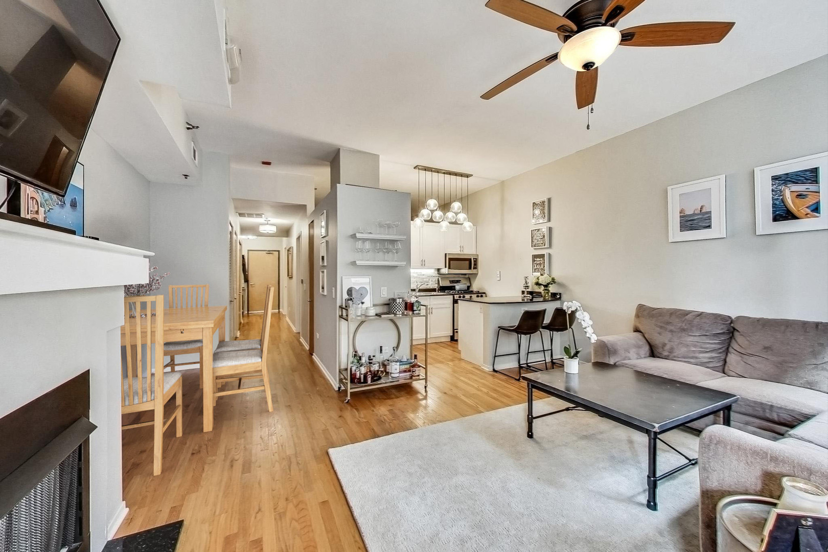 1201 West Adams Street, Unit 609 Chicago, IL 60607 - Photo 7 of 19 a living room with furniture and a fireplace