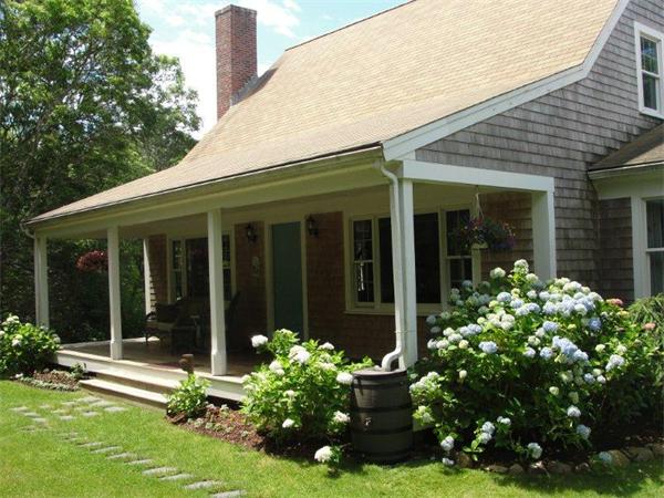 1135 Service Road Barnstable, MA 02668 - Photo 1 of 15 front view of a house with a yard