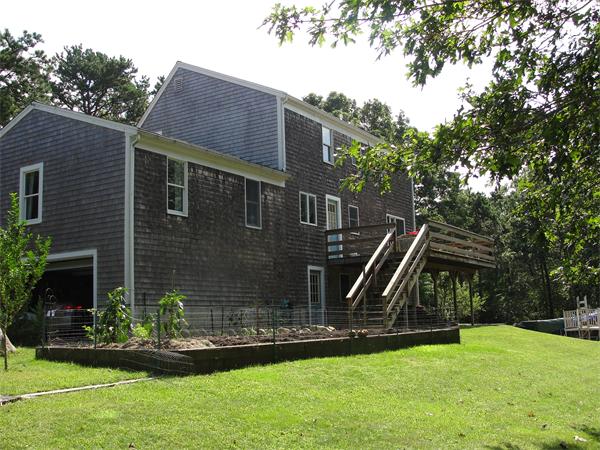 1135 Service Road Barnstable, MA 02668 - Photo 6 of 15 a view of a house with backyard