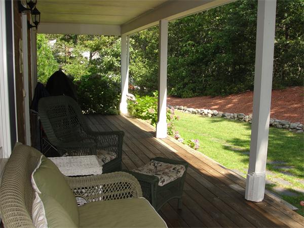 1135 Service Road Barnstable, MA 02668 - Photo 7 of 15 a view of a porch with furniture and wooden floor
