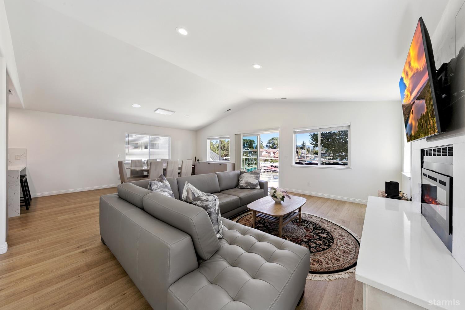 487 Christie Drive South Lake Tahoe, CA 96150 - Photo 11 of 40 a living room with furniture a flat screen tv and a couch