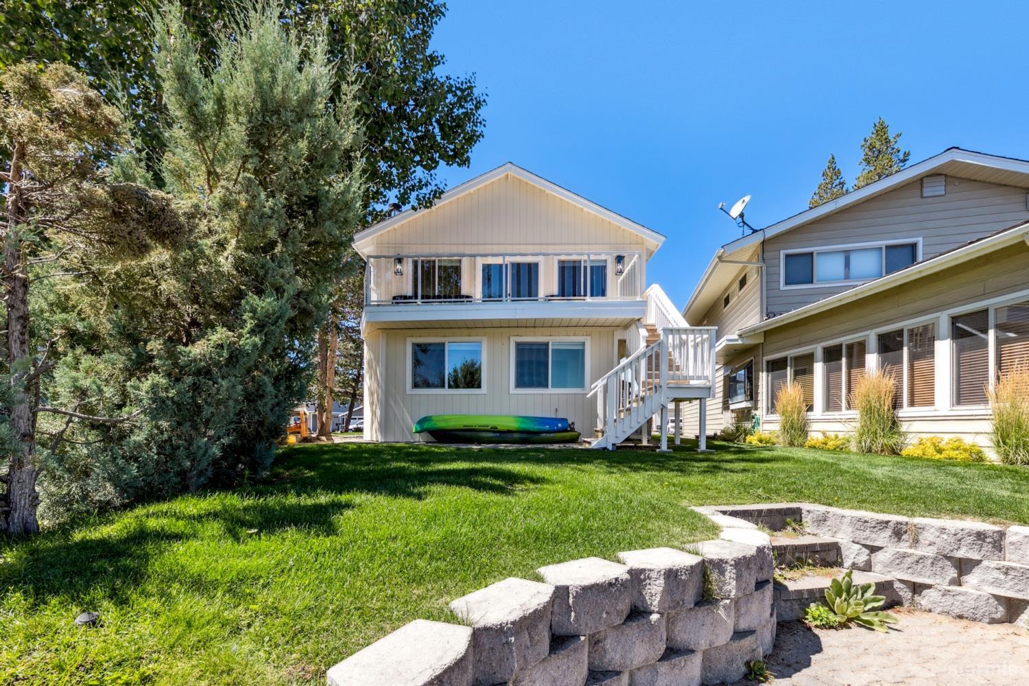 487 Christie Drive South Lake Tahoe, CA 96150 - Photo 17 of 40 a front view of a house with a yard table and chairs