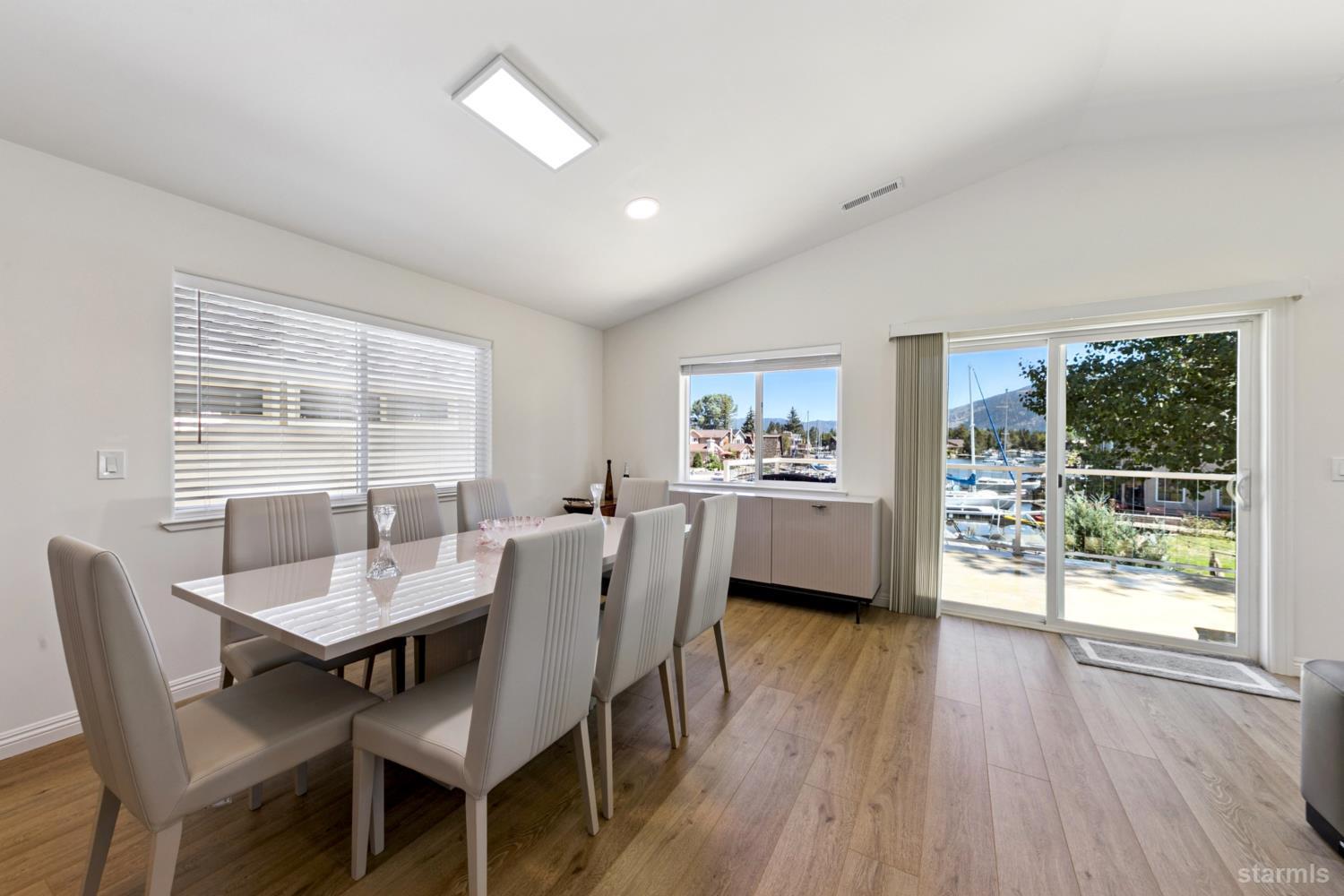487 Christie Drive South Lake Tahoe, CA 96150 - Photo 24 of 40 a view of a dining room with furniture and wooden floor