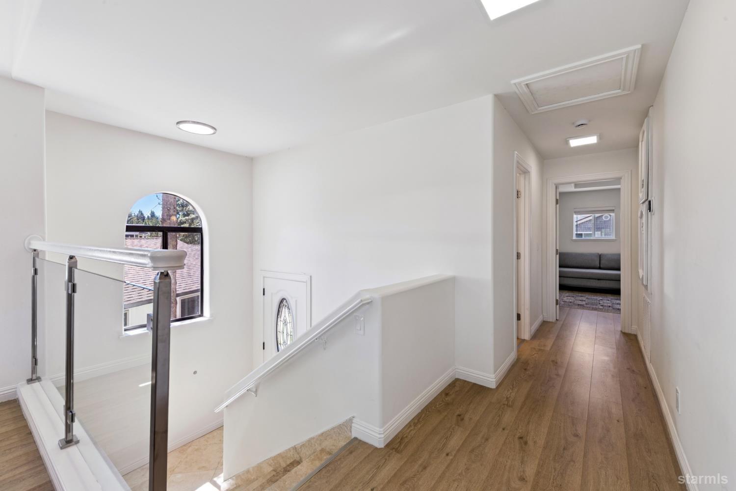 487 Christie Drive South Lake Tahoe, CA 96150 - Photo 29 of 40 a view of a hallway view with wooden floor and staircase