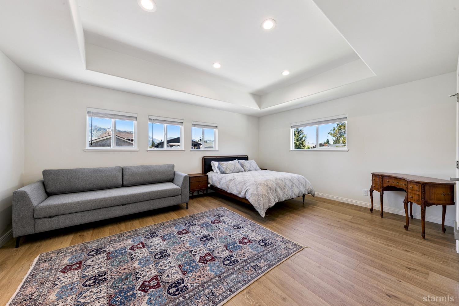 487 Christie Drive South Lake Tahoe, CA 96150 - Photo 31 of 40 a bedroom with a large bed and a couch