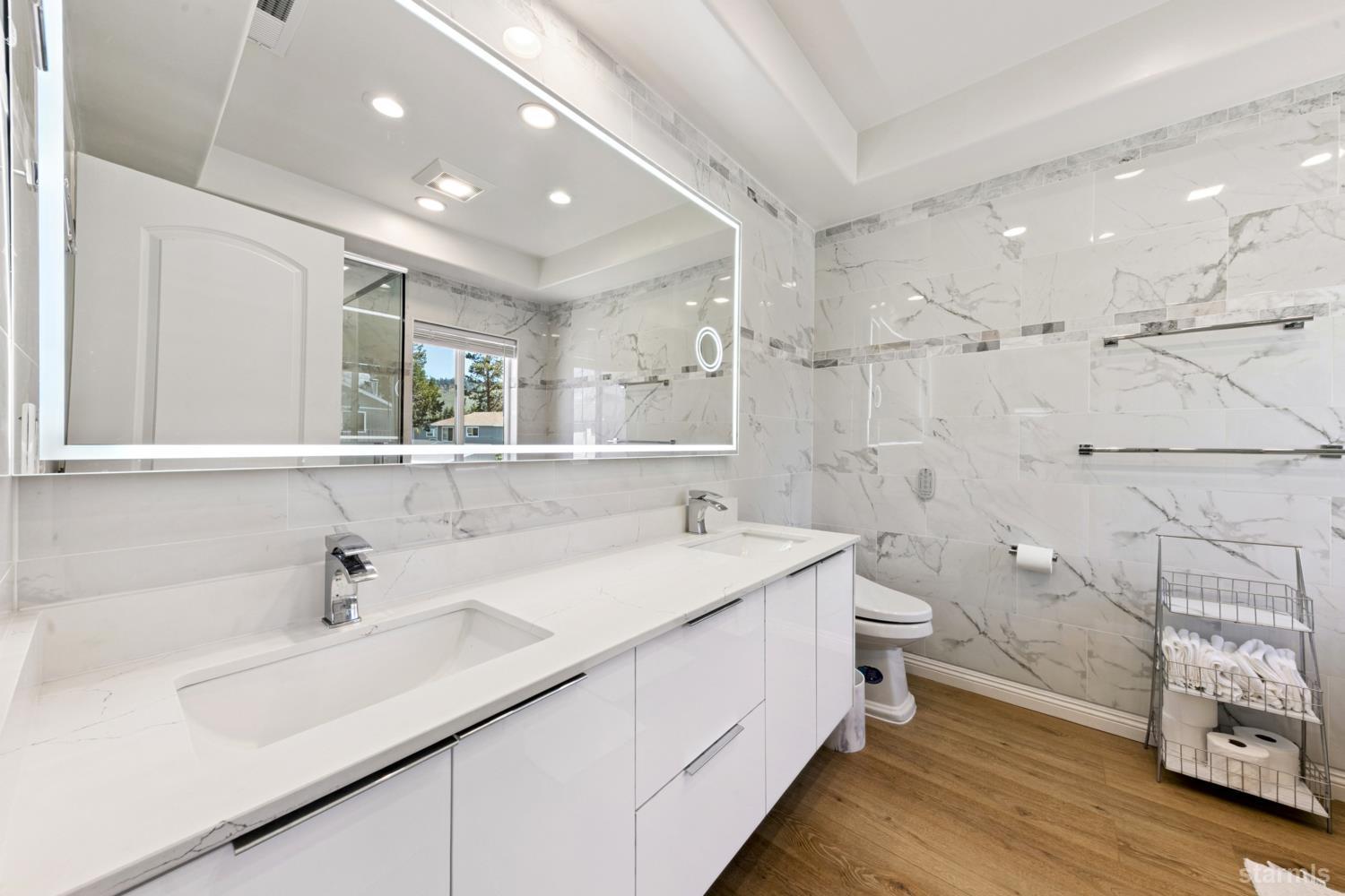 487 Christie Drive South Lake Tahoe, CA 96150 - Photo 33 of 40 a bathroom with a sink a toilet and shower