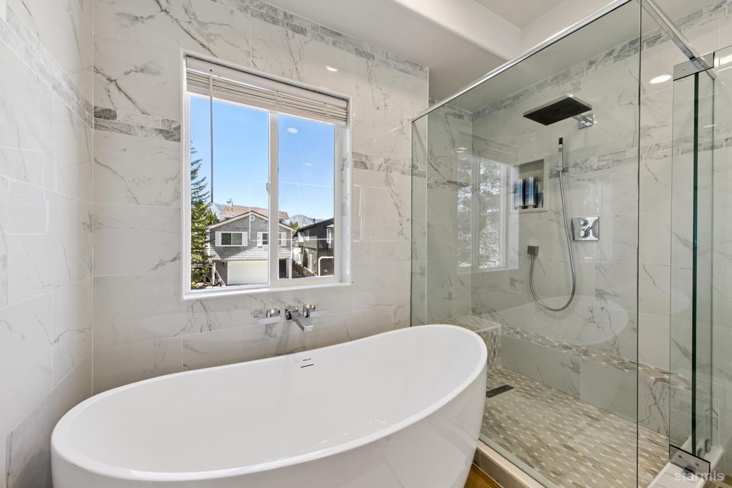 487 Christie Drive South Lake Tahoe, CA 96150 - Photo 34 of 40 a bathroom with a bathtub and shower