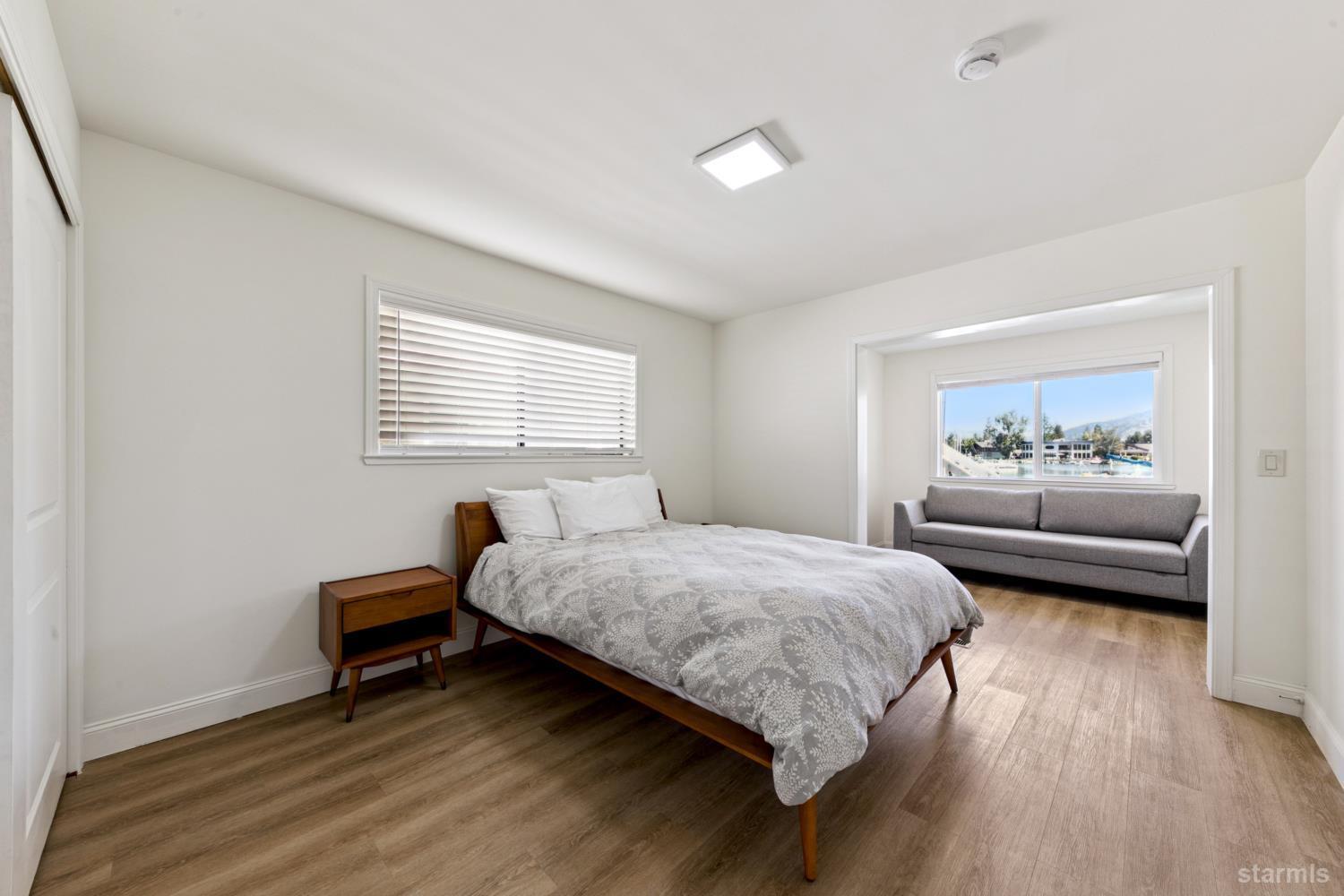 487 Christie Drive South Lake Tahoe, CA 96150 - Photo 38 of 40 a bedroom with a bed and a window