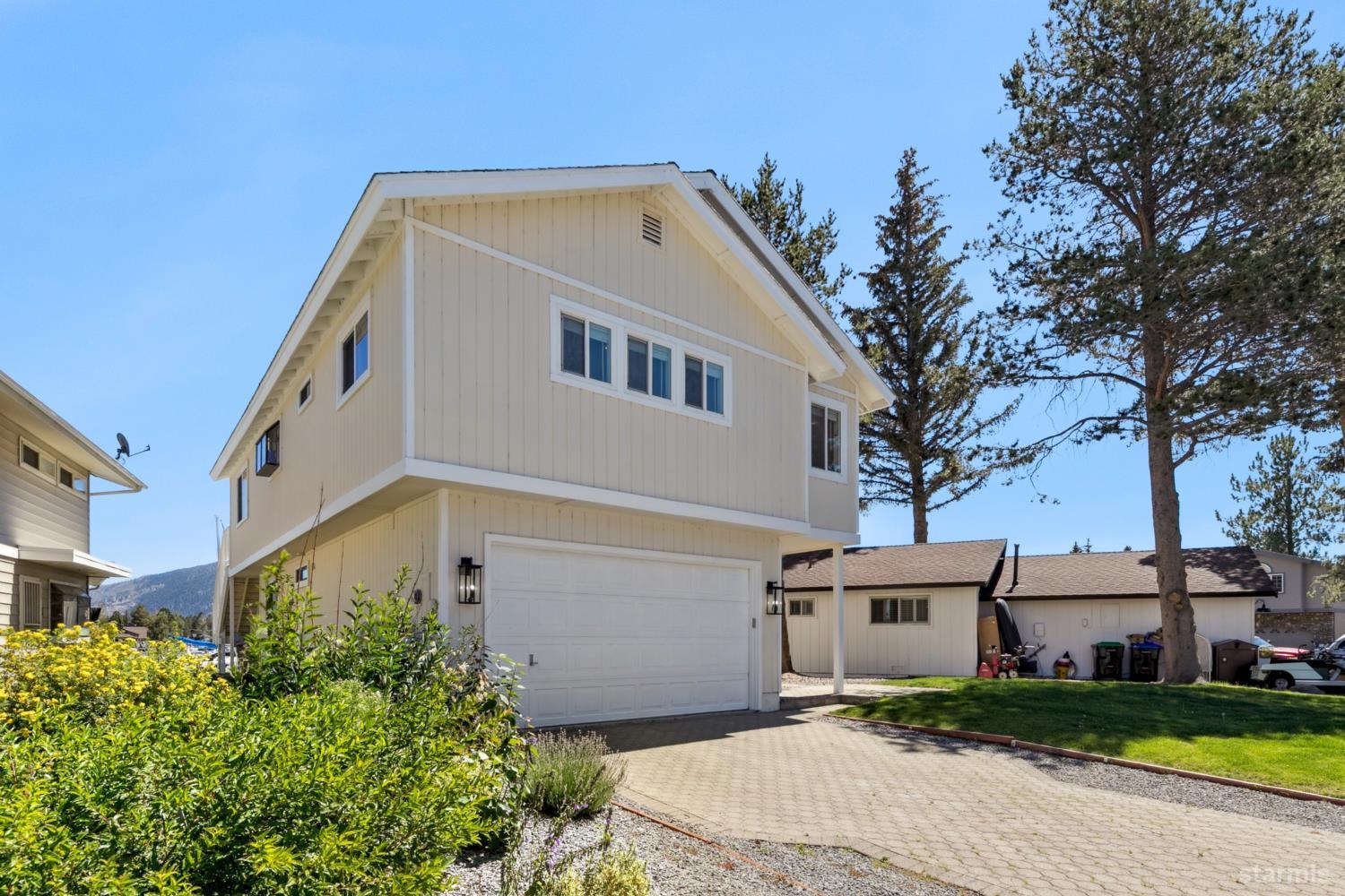 487 Christie Drive South Lake Tahoe, CA 96150 - Photo 8 of 40 a front view of a house with a yard
