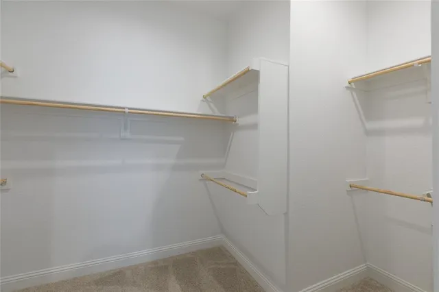a view of an empty walk in closet