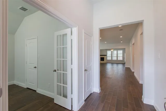 wooden floor with white walls