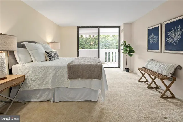 a kitchen with a table chairs sink and cabinets
