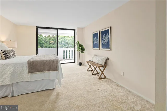 a room with pool table and windows