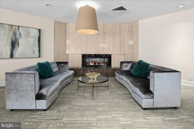 a room with pool table and windows