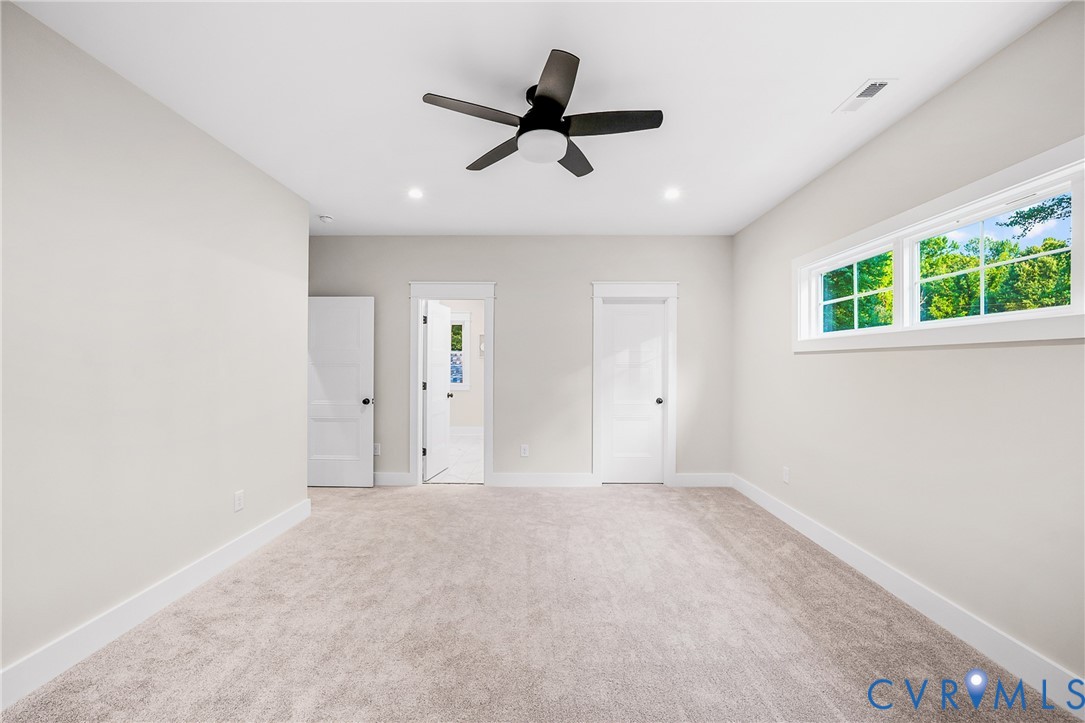 8299 Pamlico Road Ashland, VA 23005 - Photo 29 of 35 an empty room with ceiling fan and window