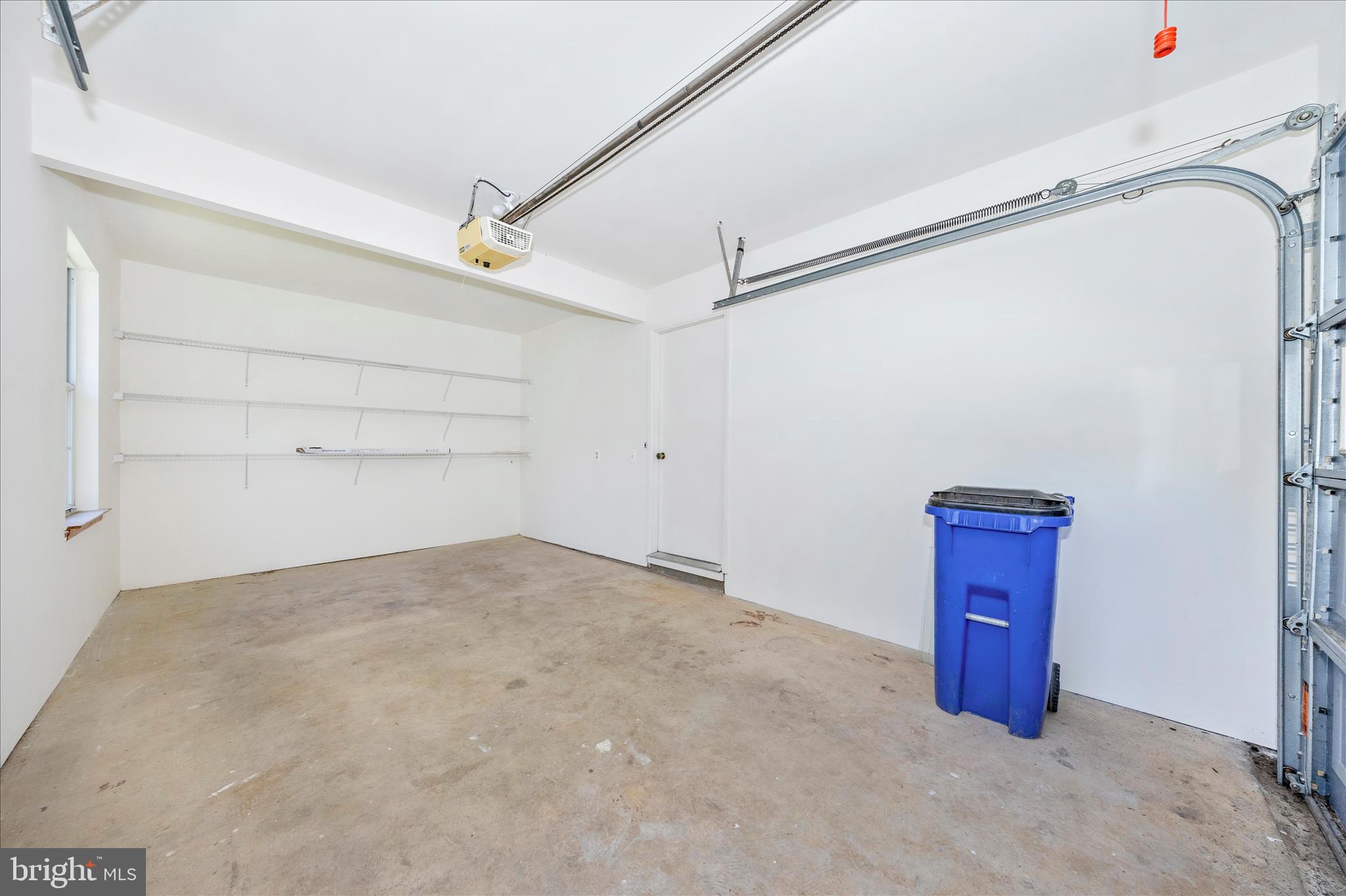 5738 Box Elder Court Frederick, MD 21703 - Photo 28 of 50 an empty room with windows and cabinet