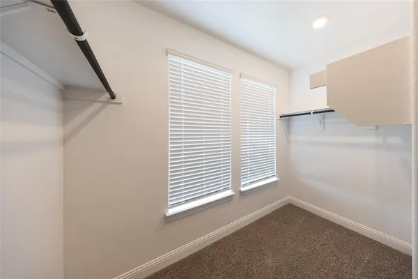 a view of a room that has a window in it