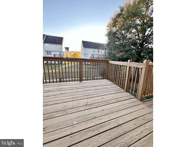 a view of balcony with wooden floor