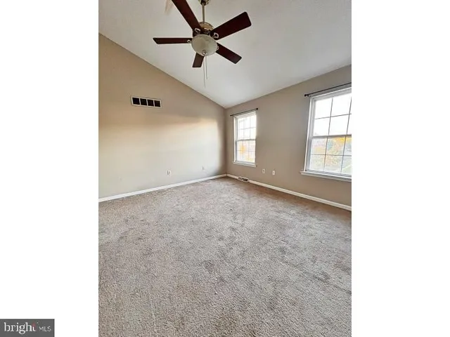 a view of empty room with windows