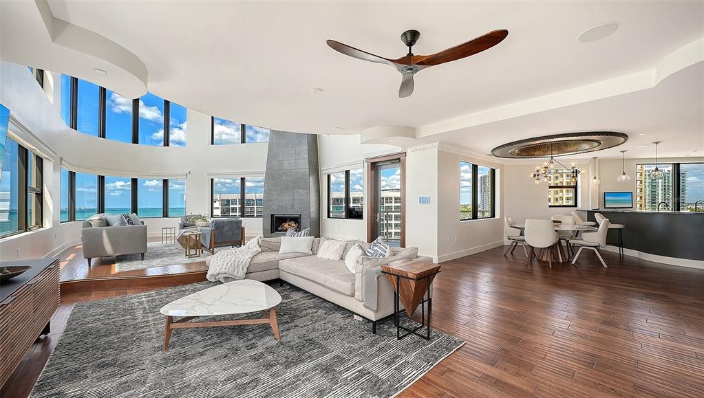 128 Golden Gate Point, Unit 901/1001 Sarasota, FL 34236 - Photo 11 of 55 a living room with furniture and a large window