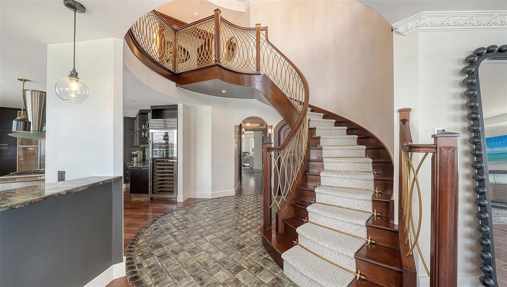 128 Golden Gate Point, Unit 901/1001 Sarasota, FL 34236 - Photo 27 of 55 a view of entryway and hall with wooden floor