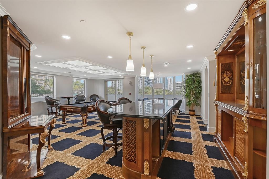 128 Golden Gate Point, Unit 901/1001 Sarasota, FL 34236 - Photo 47 of 55 a dinning area with pool table and chairs