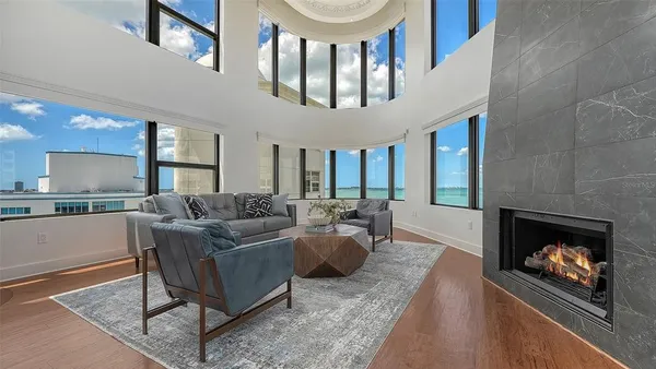 a living room with furniture and a fireplace