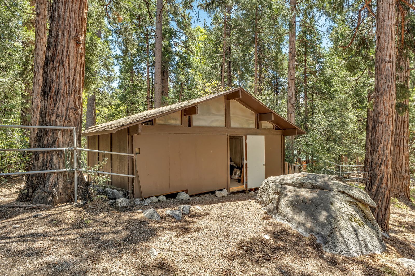 25100 Indian Rock Road Idyllwild, CA 92549 - Photo 6 of 75 a house with trees in the background