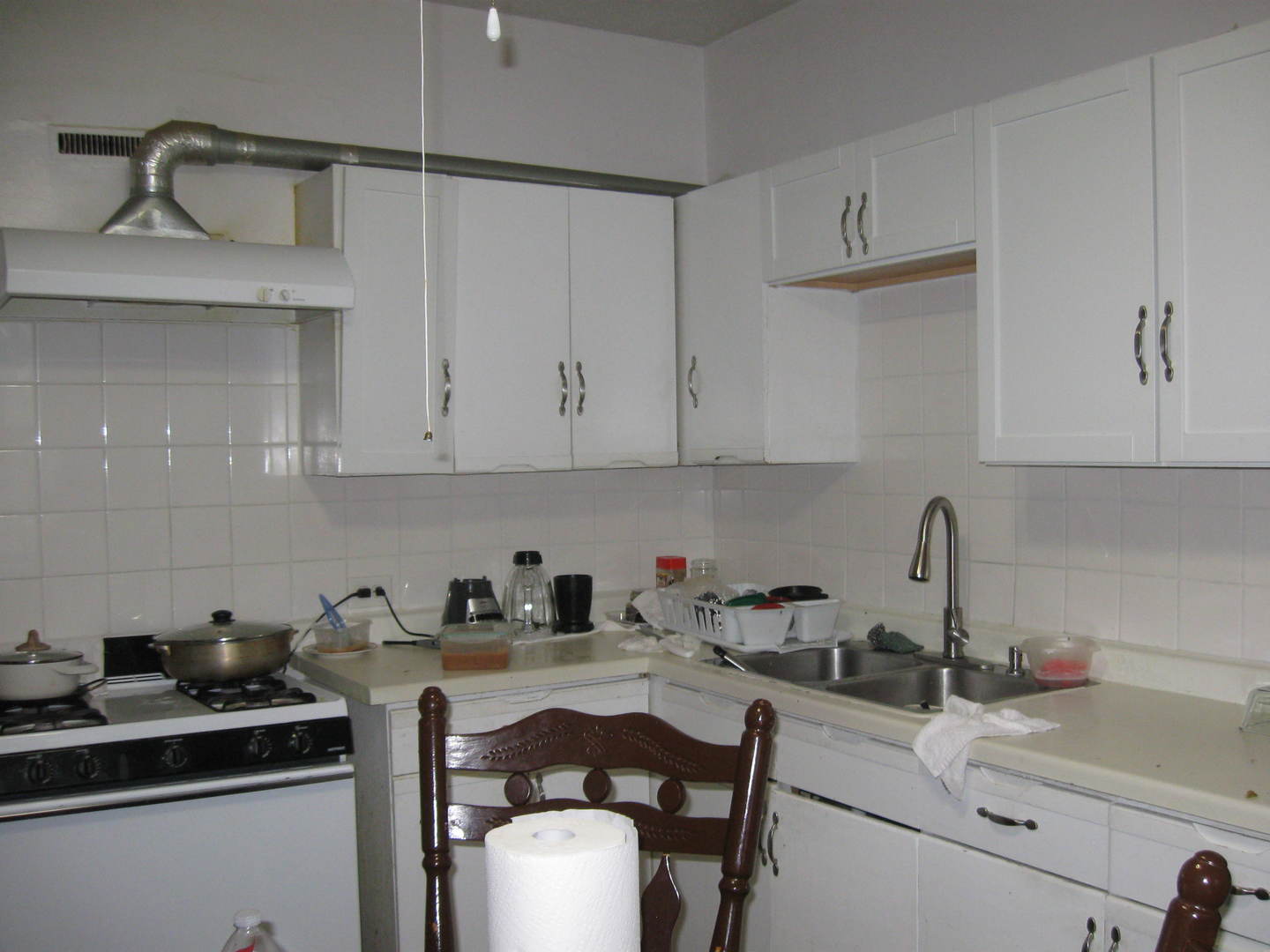 2553 West 45th Street Chicago, IL 60632 - Photo 9 of 15 a kitchen with a sink cabinets and window