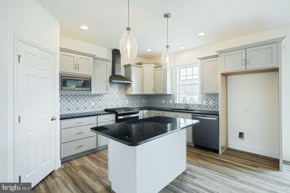 0 Old Orch Road, Unit DANBURY Strasburg, PA 17579 - Photo 9 of 21 a kitchen with a refrigerator sink and stove