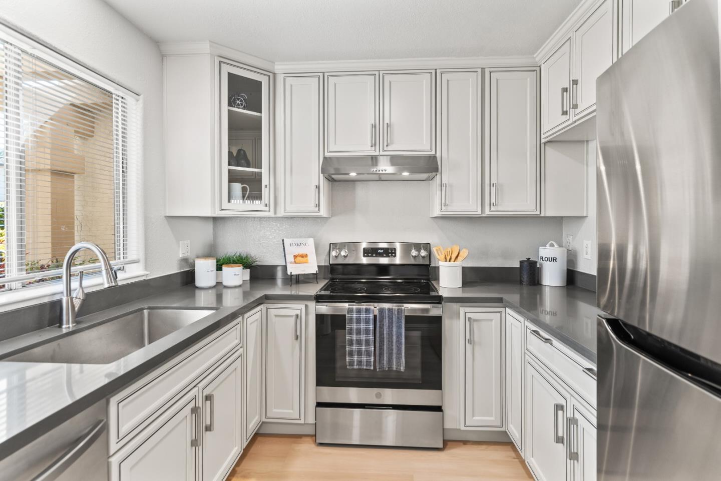 1264 Riesling Terrace Sunnyvale, CA 94087 - Photo 13 of 30 a kitchen with stainless steel appliances granite countertop a sink stove and refrigerator