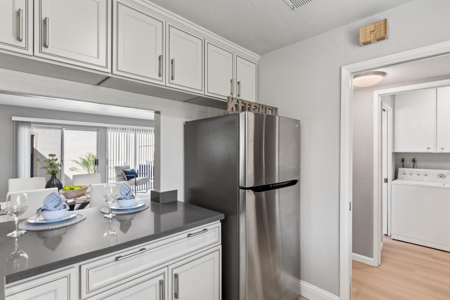 1264 Riesling Terrace Sunnyvale, CA 94087 - Photo 16 of 30 a kitchen with stainless steel appliances granite countertop a refrigerator and a cabinets