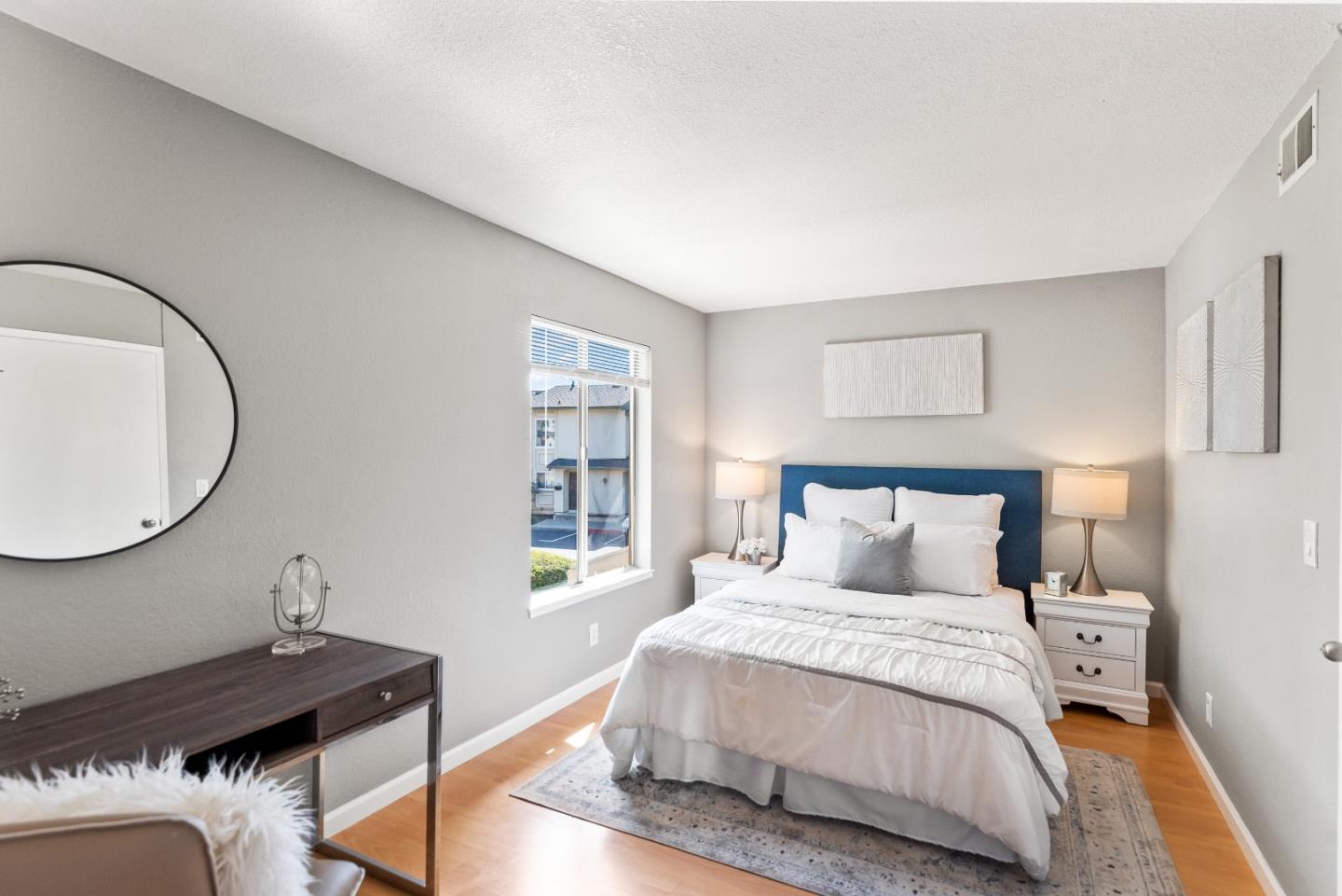 1264 Riesling Terrace Sunnyvale, CA 94087 - Photo 23 of 30 a bedroom with a bed and a table in it
