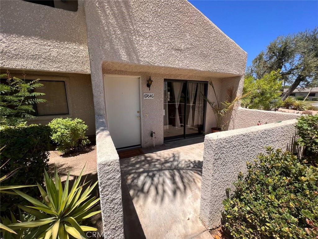 69646 Antonia Way Rancho Mirage, CA 92270 - Photo 3 of 50 a view of a house with potted plants