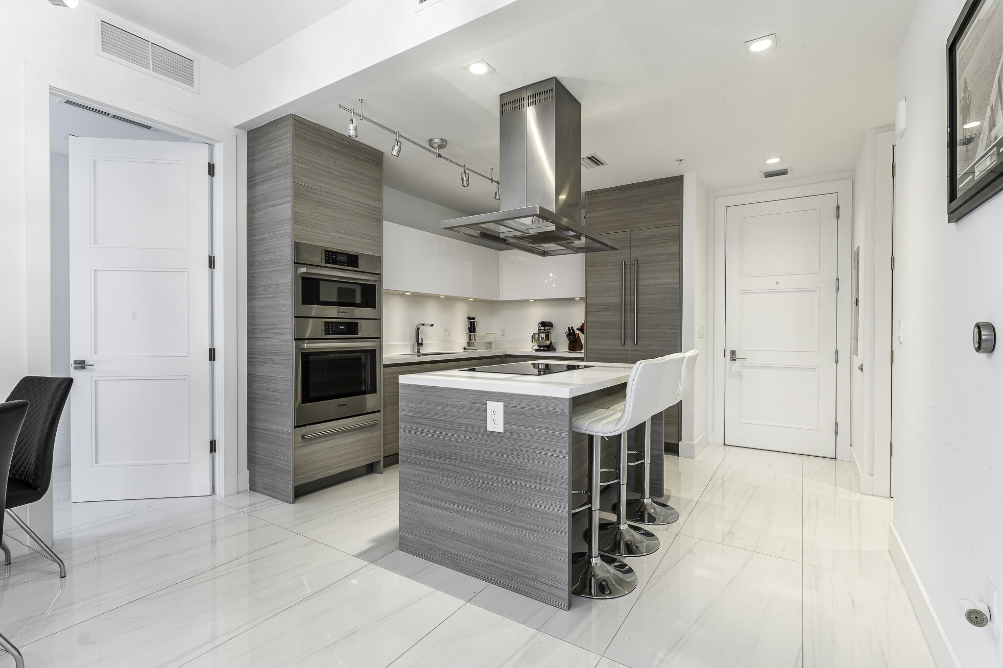 155 East Boca Raton Road, Unit 415 Boca Raton, FL 33432 - Photo 2 of 41 a kitchen with a refrigerator and countertop sink