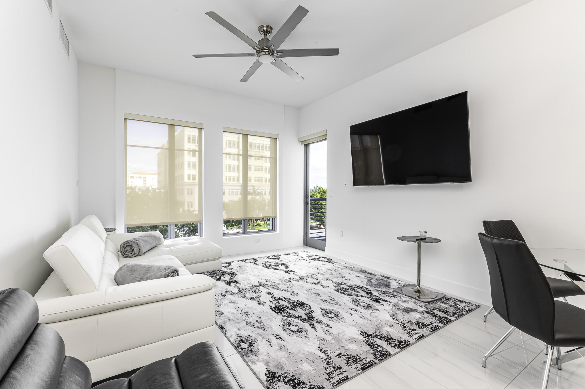 155 East Boca Raton Road, Unit 415 Boca Raton, FL 33432 - Photo 5 of 41 a spacious bedroom with a bed and a flat screen tv