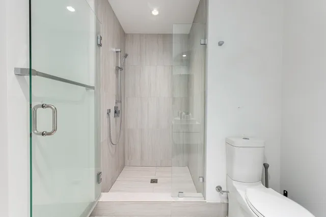 a bathroom with a bathtub and a shower