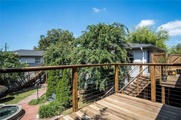 a view of a balcony with wooden floor