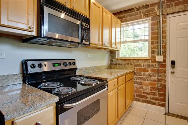 a kitchen with a stove and a microwave