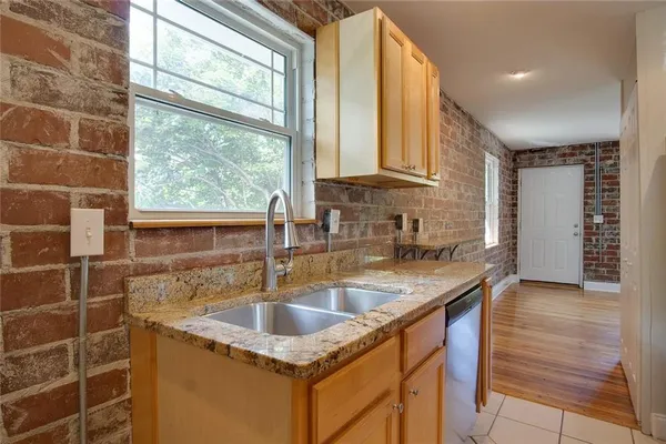 a kitchen that has a sink and a window